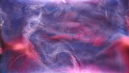 Blue pink smoke on black ink background, colorful fog, abstract swirling ocean sea, acrylic paint pigment underwater