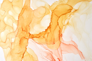 Abstract ocher watercolor on white background. Yellow orange brown paint stains and spots in water,...