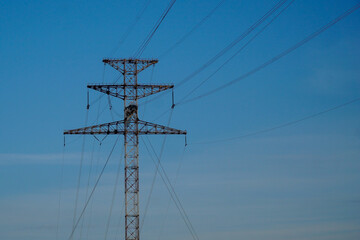 Power transmission towers against the blue sky....