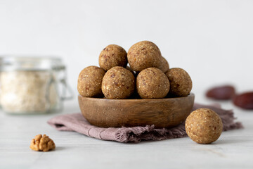 Healthy Granola Energy Balls with Nuts, Dates, Raisins. Raw dessert. A healthy dessert without sugar. Concept of vegetarian raw snack or food