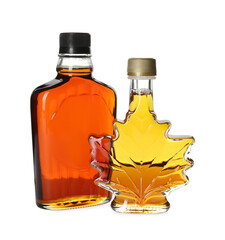 Different bottles of tasty maple syrup on white background
