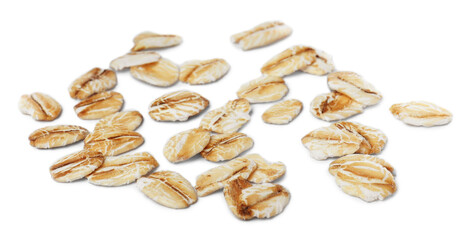 Scattered dry raw oatmeal on white background