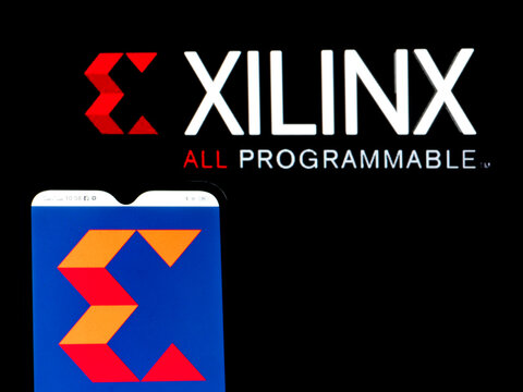 In this photo illustration Xilinx, Inc. logo seen displayed on a smartphone in the background.