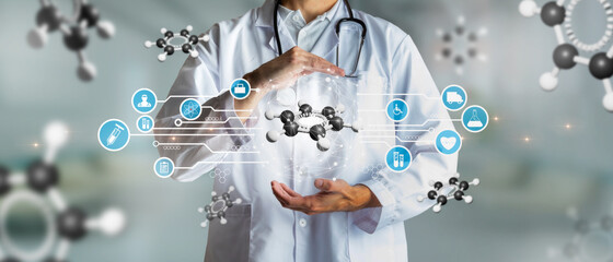 Doctor holding a carbon atom in concept of science and innovation. Medical future technology and...