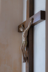 Jesus christ on the cross with Wall background in catholic church