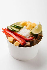 Poke bowl, lunch bowl with fresh vegetables and rice. 