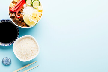 Poke bowl, lunch bowl with fresh vegetables and rice. 