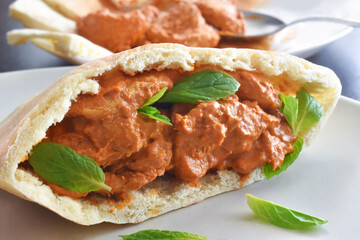 Indian chicken curry with pitta bread.  Traditional Indian food. 