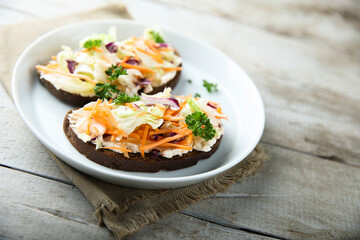 Homemade toast with cream cheese and vegetables