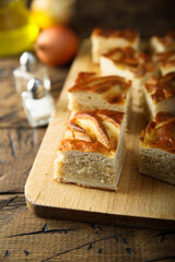 Traditional Russian cabbage pie on a wooden desk