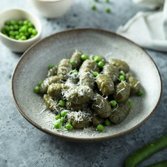 Homemade spinach gnocchi with green pea