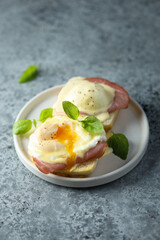 Traditional homemade Benedict eggs with ham