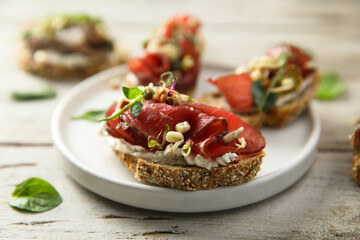Bruschetta with meat and cream cheese