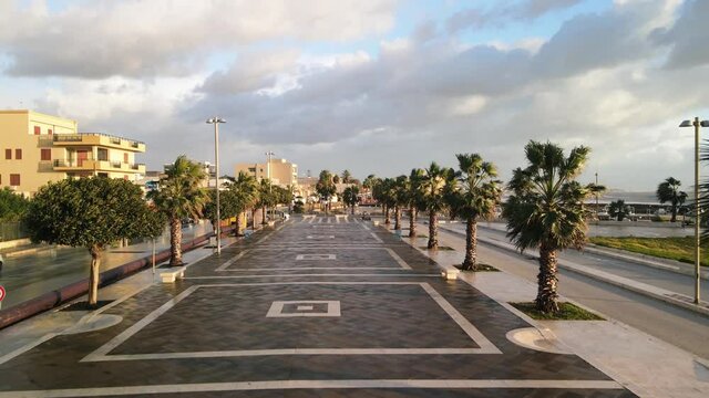 Aerial view of Mazara del Vallo city promenade along the ocean, beautiful coast of Sicily at sunset from drone