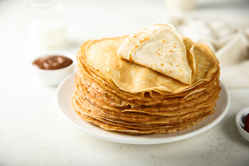 Traditional homemade crepes on a white plate