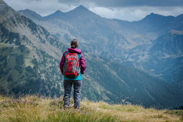 Fototapeta na wymiar Young hiker in the mountains