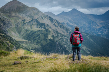 Fototapeta na wymiar Young hiker girl in the mountains