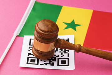 Judge gavel, barcode sheet and Senegalese flag, concept of administrative punishment for violation...