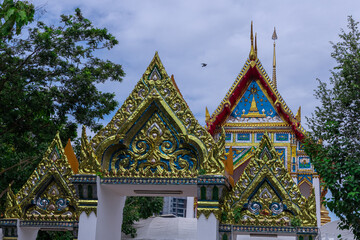 Buddhist temple Was on Sukhumvitt Rd BKK Bangkok Thailand, vivid lush colours if the buildings are glorious