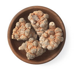 Dried notoginseng in the wooden bowl,  isolated on white background, top view