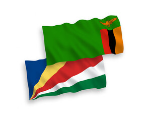 National vector fabric wave flags of Republic of Zambia and Seychelles isolated on white background. 1 to 2 proportion.