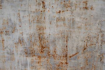 The texture of old rusty metal. Spots and streaks of rust on the light metal surface. Metal rusty texture background rust steel. Industrial metal texture. Grunge rusted metal texture, rust background