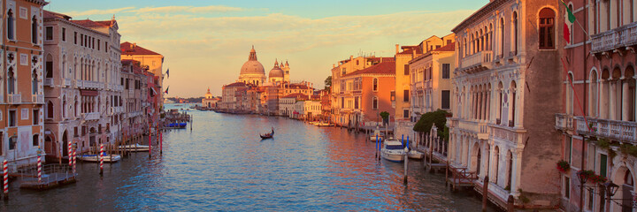 Grand Canal, Basilica Santa Maria della Salute at dawn in Venice. Panoramic banner panorama image.
