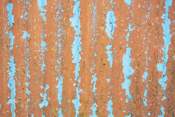 Metal light blue textured. Corroded metal background. Rusted white painted metal wall. Rusty metal background with streaks of rust. Rust stains. The metal surface rusted spots. 