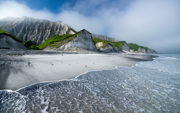 White Rocks of Iturup island. White rocks have stretched for miles alongside the shore of the Okhotsk sea. They are formed of a very light and soft pumice as a result of the huge volcanic eruption. 