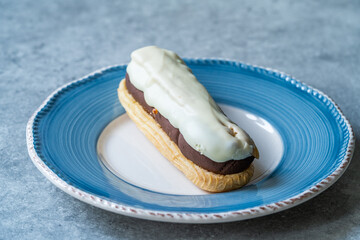 Eclairs Topped with White Chocolate and Bitter Cream.