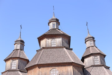 Orthodox church in Ukraine, old church on blu sky the background. Old temple made of wood . religion,