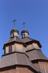 Orthodox church in Ukraine, old church on blu sky the background. Old temple made of wood . religion,