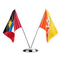 Two table flags isolated on white background 3d illustration, antigua barbuda and bhutan