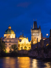Fototapeta na wymiar View of Charles Bridge in Prague in the night, Czech Republic. popular tourist attraction. Travel and sights of city breaks. landmarks, travel guide and postcard.