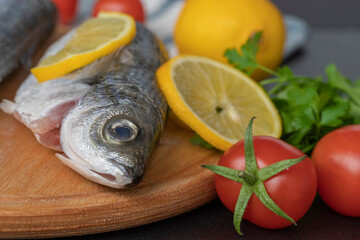 Freshly Caught Bogue Fish Or Boops Boops fish ready to be cooked on wooden cutting board : Turkish name Kupes fish