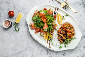 salad with vegetables, cheese and fresh salmon rolls. banner, menu, recipe place for text, top view