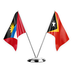 Two table flags isolated on white background 3d illustration, antigua barbuda and timor leste