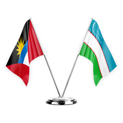 Two table flags isolated on white background 3d illustration, antigua barbuda and uzbekistan