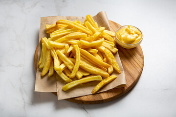 Homemade baked potato fries with cheese sauce fast food