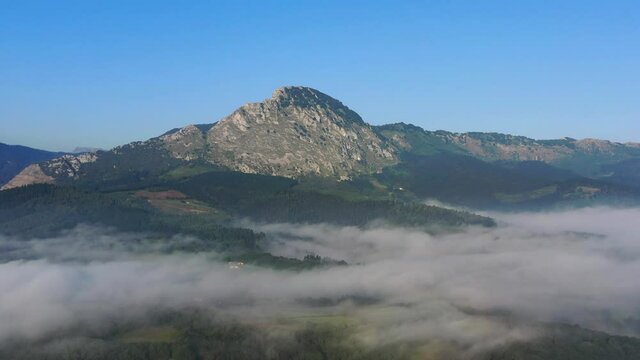 aerial view of the mountain and morning fog in the suburb of Durango, Basque Country.