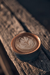 Selective focus cup of hot latte art coffee