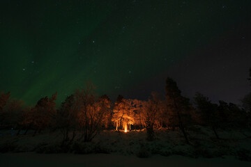 Bonfire and Aurora Borealis in Finnish Lapland