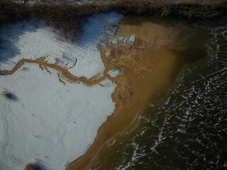 limestone sump, beautiful natural pattern, small polluted lake, frozen lake, chemical waste in the lake