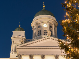 Fototapeta na wymiar Christmas tree on the background of St. Nicholas Cathedral in Helsinki.