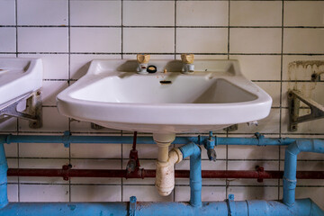 Closeup of an old washbasin in a derelict house