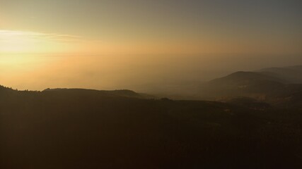 Sunrise in the Jizera mountains. Forest and fog.