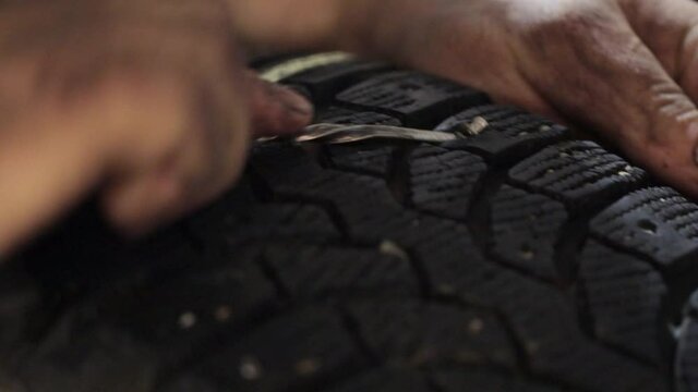 Removing worn-out tire spikes process