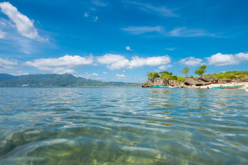 Low angle view of a rocky outcrop at a small cove at Laiya, San Juan, Batangas, Phillipines.