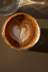 Special coffee with cinnamon in a glass glass