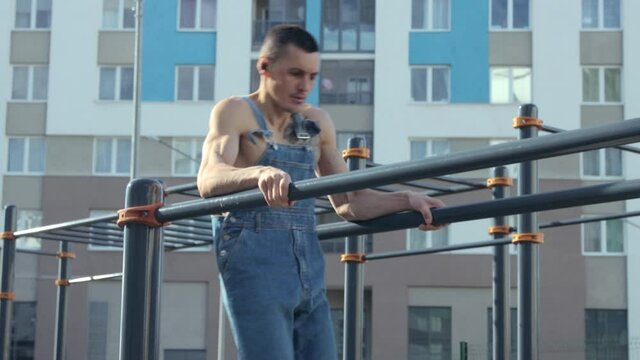 A man exercising on a sports ground